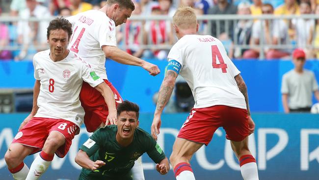 Soccerooâ€™s Daniel Arzani is tackled by Denmarkâ€™s Thomas Delaney and Denmarkâ€™s Henrik Dalsgaard during the World Cup match between Australia and Denmark at Samara Arena, Russia. Picture: Toby Zerna