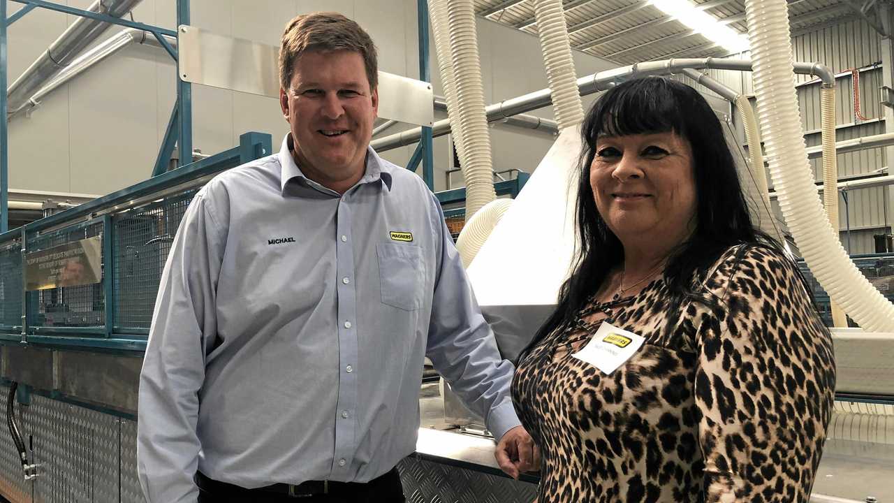 Michael Kemp and Tracey Channing in front of Wagners new composite fibre pultrusion machine. Picture: Tobi Loftus