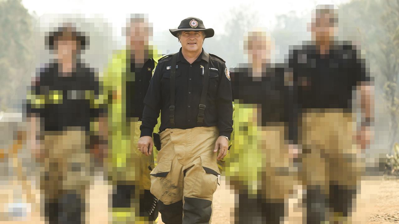 Shane Macklin among other locals who stood shoulder-to-shoulder to fight the ferocious firestorm that threatened to wipe a town – Gracemere – off the map. Picture: Mark Cranitch.