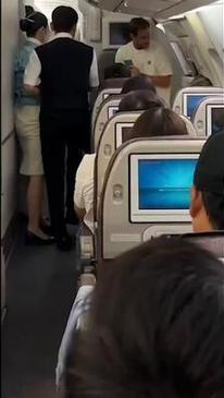 Passenger restrained after apparent attempt to open emergency exit