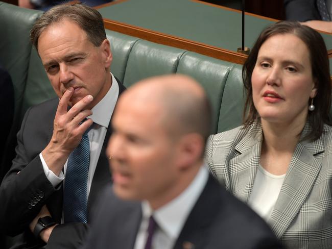 Member of the Australian House of Representatives Greg Hunt and Kelly O'Dwyer listen to Treasurer Josh Frydenberg deliver the Budget. Picture: Getty Images