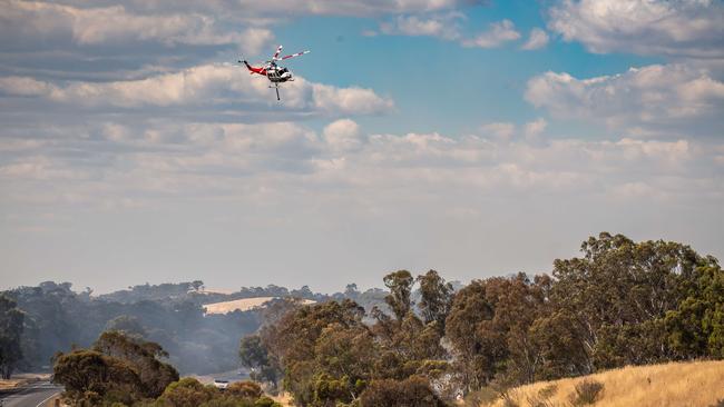 Fire crews tackle the fire from the air. Picture: Jason Edwards