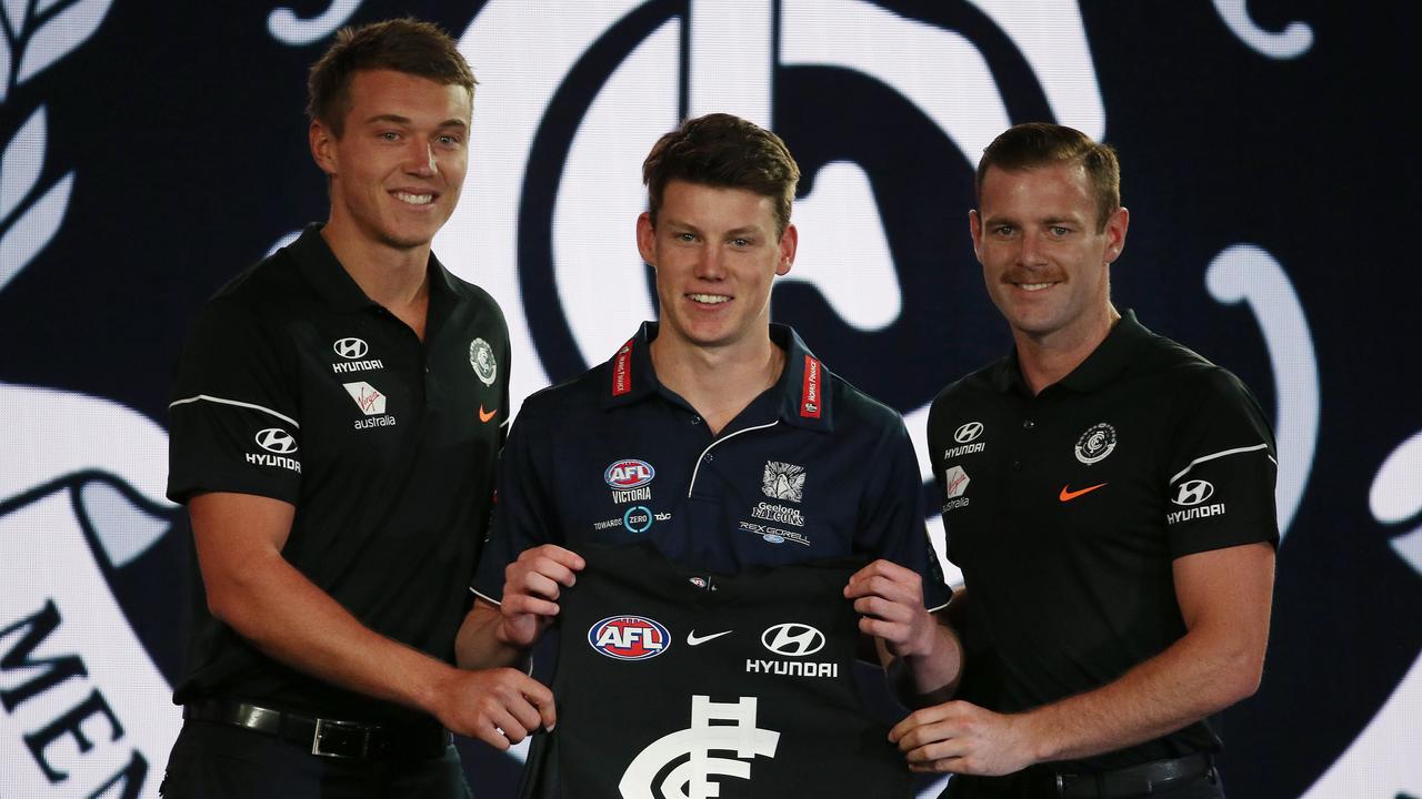 Carlton took Sam Walsh at Pick 1, with co-captains Patrick Cripps and Sam Docherty presenting his jumper. Picture: Michael Klein