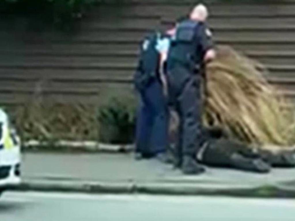 A man is arrested by police. Picture: Kurt Bayer/NZ Herald