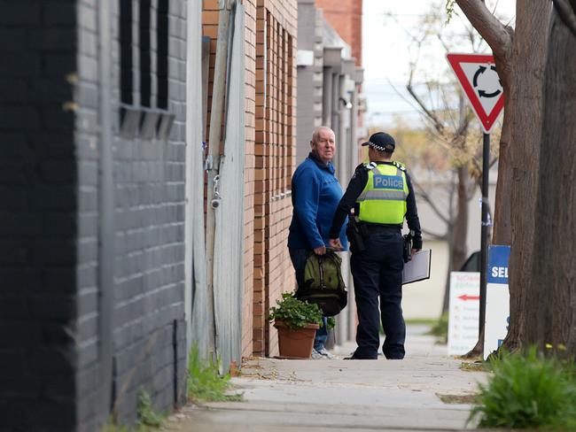 Police speak with people in the area. Picture: Sarah Matray