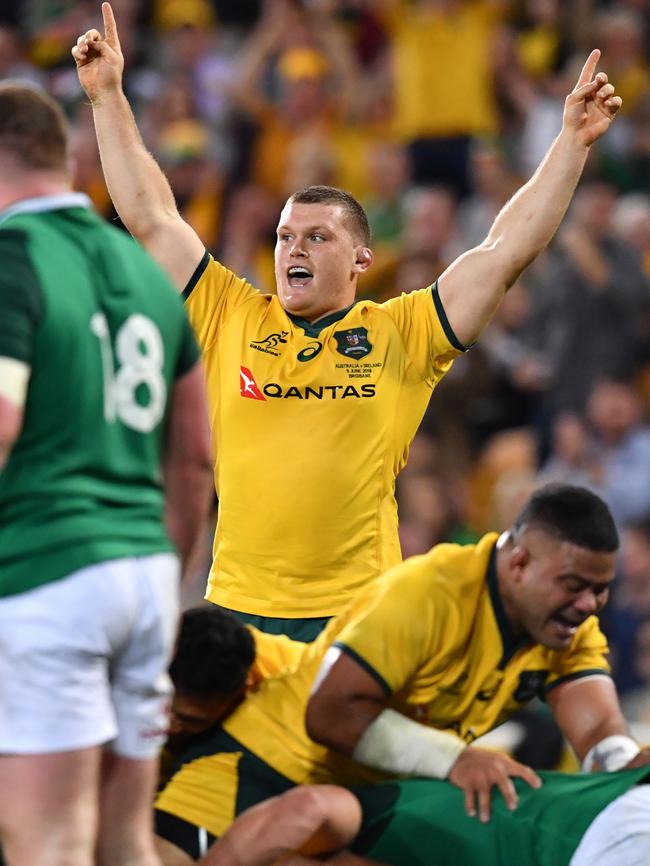 Tom Robertson (right) of the Wallabies celebrates after his team mate David Pocock of the Wallabies scored the winning try.