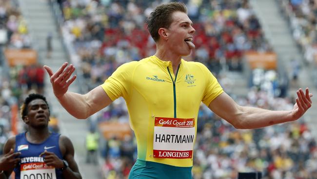 Australia's Alex Hartmann reacts as he crosses the finish line in second place in his men's 200m heat at Carrara Stadium during the 2018 Commonwealth Games on the Gold Coast. Picture: AP Photo/Mark Schiefelbein