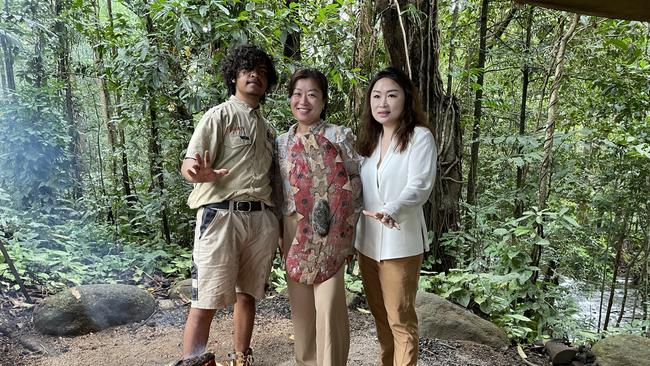 Mossman Gorge Cultural Centre guide Zayden Oui, BriStar Migration and Education agent Yun Lin and Chinese migrant Chang Natasa Liao. Photo: Supplied