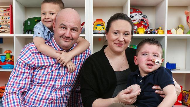 Brain tumour survivor Kristian Kozul, 2, at home in Deer Park with his parents Steve and Marie, and brother Tomislav, 5. Picture: Ian Currie