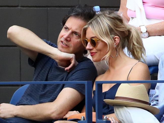 Director Bennett Miller and actress Sienna Miller attend the Men’s Singles Final Match between Novak Djokovic of Serbia and Stan Wawrinka of Switzerland on Day Fourteen of the 2016 US Open at the USTA Billie Jean King National Tennis Center on September 11, 2016. Picture: Getty