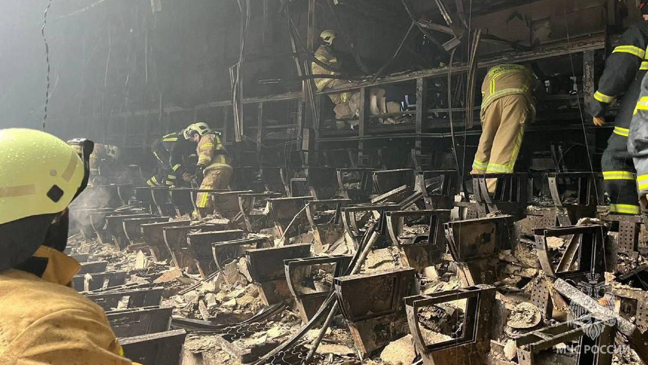 The gunmen threw a grenade or incendiary bomb which started a large fire in the building. Picture: Russian Emergcny Ministry/AFP