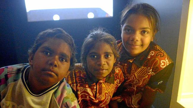 Woorabinda school students visit their own works at the gallery in Rockhampton. Picture: Jann Houley