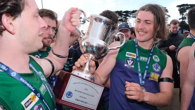 Harry Benson (right) with the 2022 premiership cup. He is the latest departure for the Saints. Picture: Mark Wilson