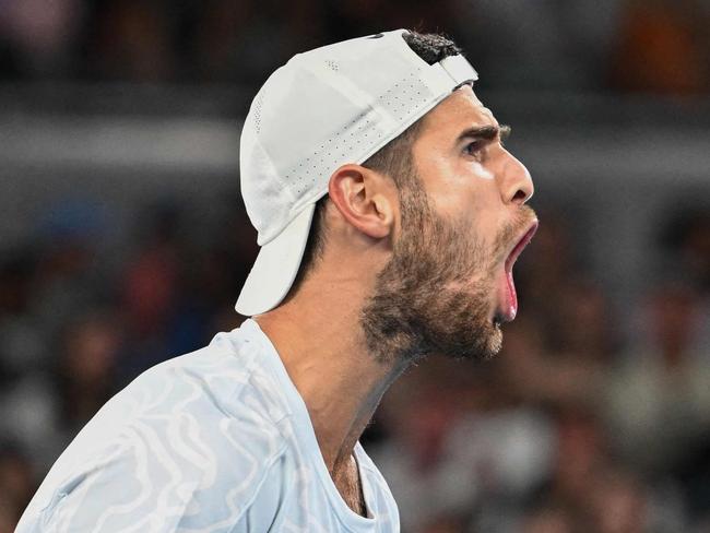 Russia's Karen Khachanov reacts after a point in tie break with Frances Tiafoe of the US during their men's singles match on day five of the Australian Open tennis tournament in Melbourne on January 20, 2023. (Photo by MANAN VATSYAYANA / AFP) / -- IMAGE RESTRICTED TO EDITORIAL USE - STRICTLY NO COMMERCIAL USE --