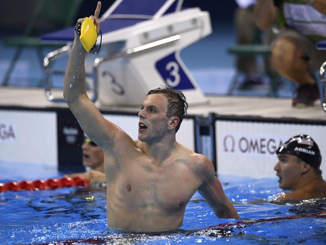 SA superfish Kyle Chalmers celebrates his 100m freestyle triumph in Rio. Picture: AFP photo / Christophe Simon