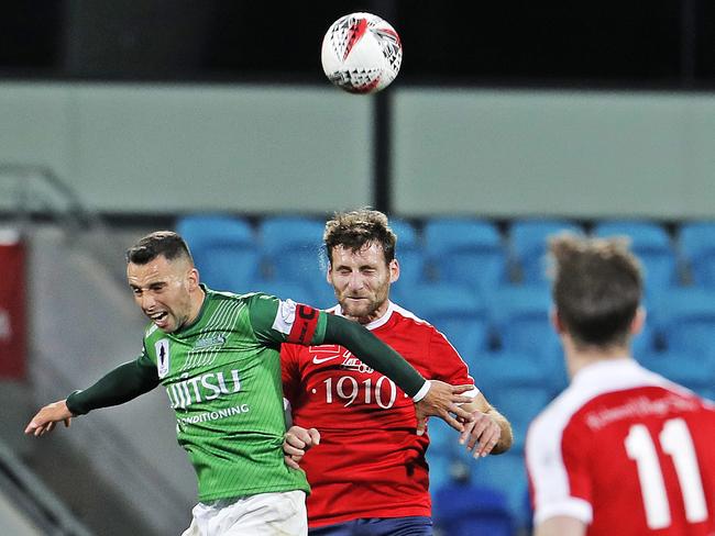 Stallions’ Marko Jesic and South Hobart’s Loic Feral compete for the ball. Picture: ZAK SIMMONDS