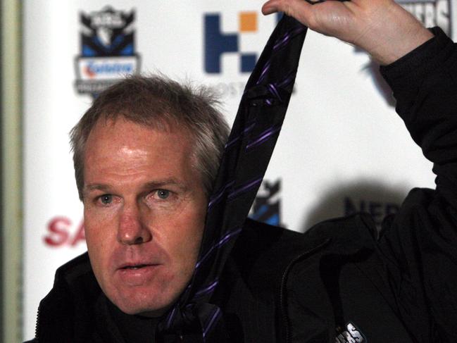 Coach Matthew Elliott jokingly strangles himself with his tie at the start of the press conference following Penrith Panthers v Manly Sea Eagles NRL game at CUA Stadium in Penrith, west of Sydney.