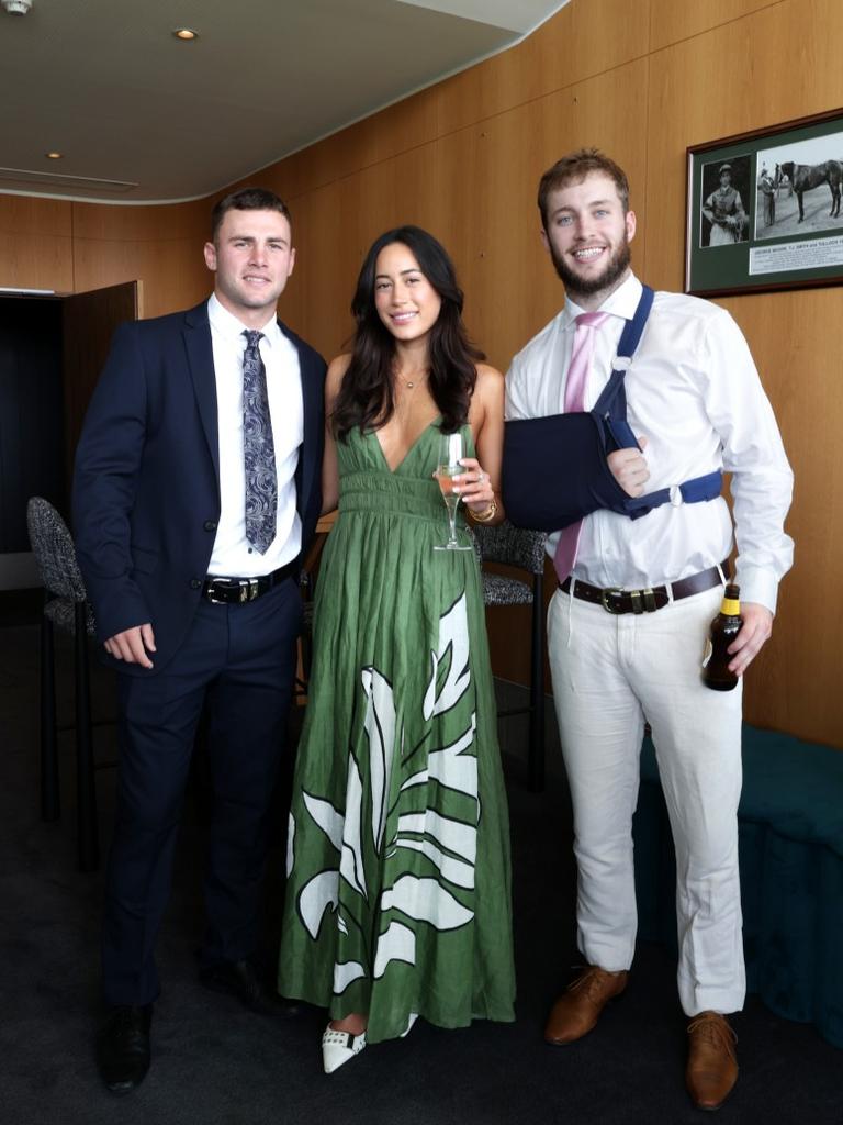 TAB Epsom Day racegoers and Sydney Roosters players Sandon Smith and Sam Walker with his partner Bella Allan at Randwick Racecourse. Jane Dempster/Daily Telegraph.