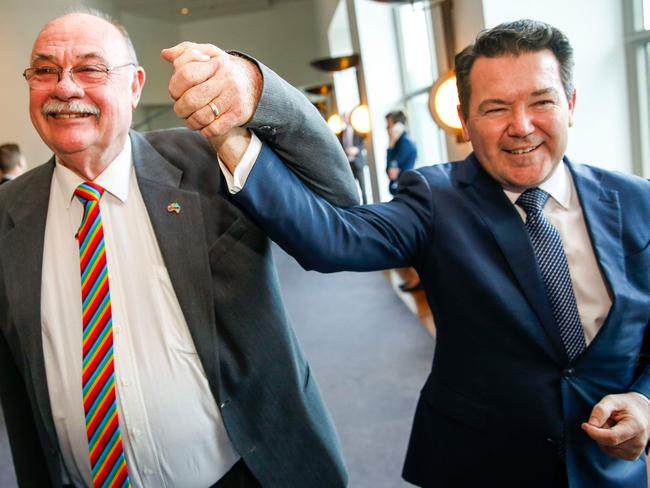 Liberal MP Warren Entsch (left) and Liberal Senator Dean Smith celebrate after parliament passes the same-sex marriage bill. Picture: Sean Davey/AFP