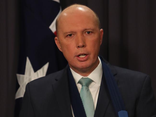 Home Affairs Minister Peter Dutton  holding a press conference at Parliament House in Canberra.