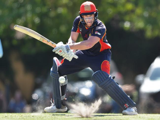 Adelaide all-rounder Ben Pengelley smashes one into the turf at Glandore Oval in the Buffalos’ three-run Twenty20 victory over Tea Tree Gully on Saturday. Picture: AAP/Mark Brake