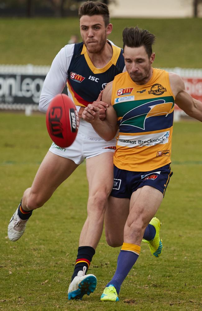 Adelaide's Paul Seedsman battles against Eagles’ James Boyd.