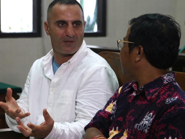 Australian Bilal Kalache sit next to the translator during the hearing at Denpasar District Court in Bali. Picture:  Lukman S. Bintoro