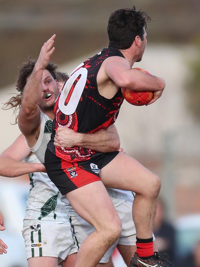 Kyabram’s Liam Ogden marks in front of Echuca’s Jack McHale.