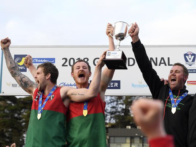 Tim Bongetti, Beau Hendry and Paddy Swayn hoist the 2018 MPNFL Division 1 premiership cup. Picture: Andy Brownbill