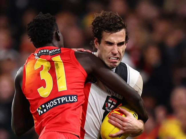 MELBOURNE, AUSTRALIA - JUNE 08: Max King of the Saints is tackled by Mac Andrew of the Suns during the round 13 AFL match between St Kilda Saints and Gold Coast Suns at Marvel Stadium on June 08, 2024 in Melbourne, Australia. (Photo by Graham Denholm/Getty Images)