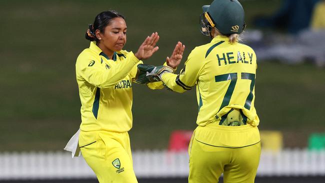 Alana King and Alyssa Healy celebrate the wicket of England’s Tammy Beaumont Picture: AFP