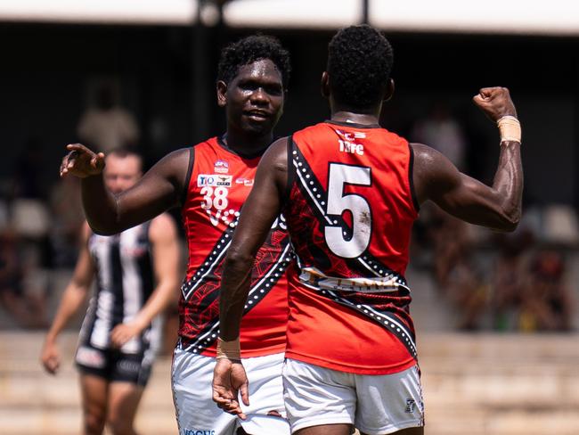 William Munkara and Kim Kantilla celebrate a goal for the Tiwi Bombers in the 2024-25 NTFL season. Picture: Jack Riddiford / AFLNT Media