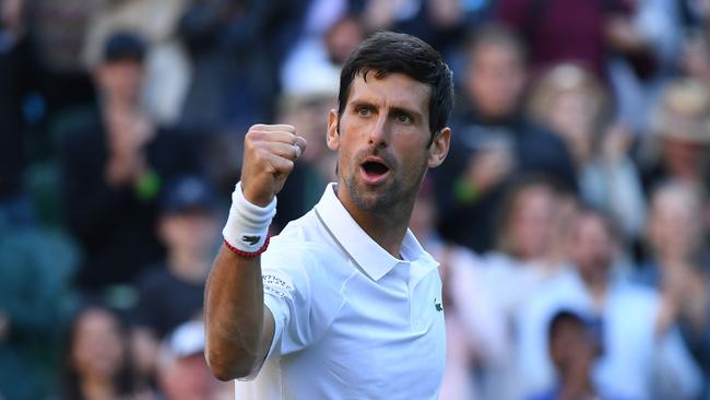 Serbia's Novak Djokovic celebrates beating US player Denis Kudla during their men's singles second round match on the third day of the 2019 Wimbledon Championships at The All England Lawn Tennis Club in Wimbledon, southwest London, on July 3, 2019. (Photo by Ben STANSALL / AFP) / RESTRICTED TO EDITORIAL USE