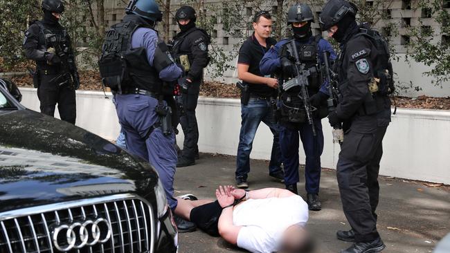 Joshua Baines is detained by police at Olympic Park.