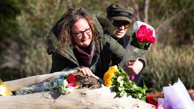 Courtney’s devastated mum lays flowers at the logs where her body was found. Picture: Sarah Matray