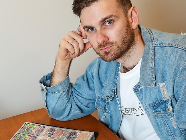 Elliot Weston at home with some of his Pokemon cards. Many Pokemon fans have lost money in an online scam. Picture: Ian Currie