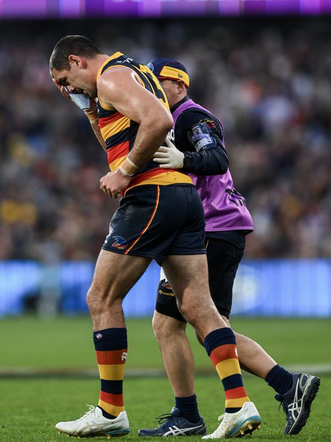 Taylor Walker of the Crows in pain after being hit high by Tim English. Picture: Mark Brake/Getty Images)