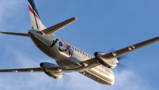 Adelaide, Australia - REX (Regional Express Airlines) Saab 340 twin engined regional commuter aircraft taking off from Adelaide Airport.Escape 15 October 2023Doc HolidayPhoto - iStock