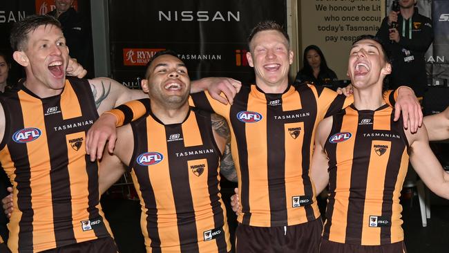 Hawthorn players celebrate making the 2024 AFL finals after defeating North Melbourne.