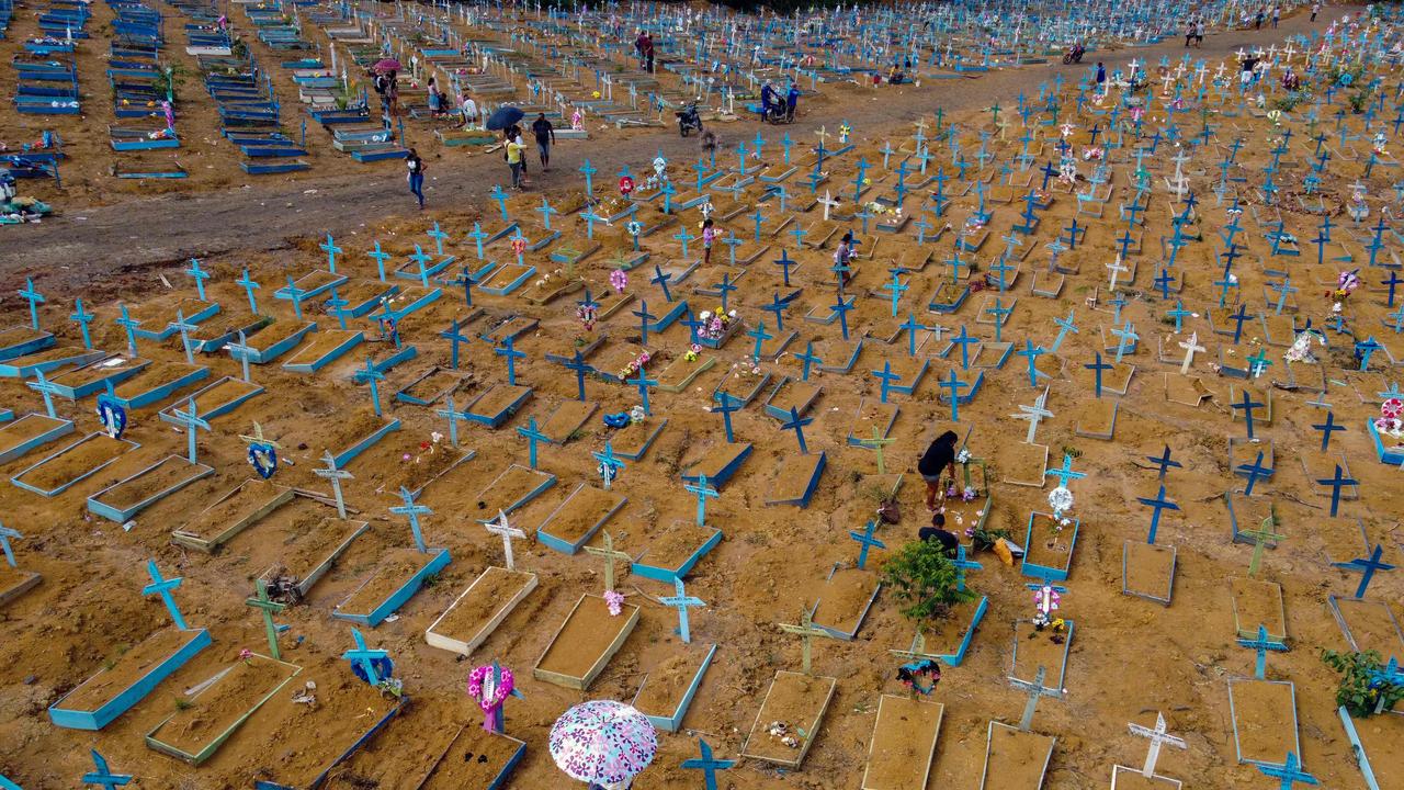 People visit the Nossa Senhora Aparecida cemetery on Mother's Day, in Manaus, Amazonas State. Cemeteries in Brazil opened for the first time for the general public since the start of the pandemic and deaths remain stubbornly high, with 587,066 deaths from 21,006,424 cases in the most recent reporting period. Picture: Michael Dantas / AFP