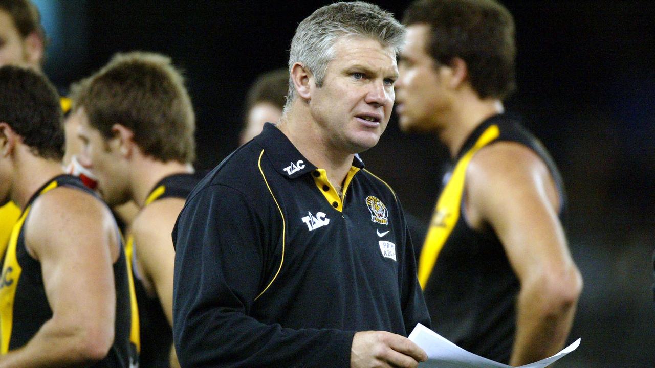 12/07/2003. Coach Danny Frawley leaves the 3/4 time huddle. Richmond v Geelong. Telstra Dome. Digital Image.