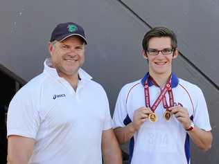 THAT'S GOLD: Toowoomba's Mason Hughes (right) celebrates school state title success with coach Justin Anlezark. Anlezark has high praise for Sports Darling Downs and the group's passion for advancing sport in the region. Picture: CONTRIBUTED