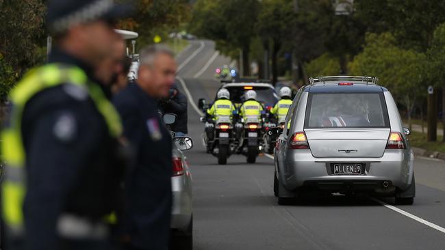 The hearse leaves the funeral of Senior Constable Kevin King.