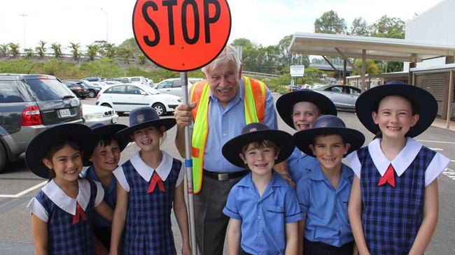 Ted Pretty with students from Year 3, 4 and 5 at Sunshine Coast Christian College on his final day as the Lollypop man. Photo Kiera Kelly-Williamson / Caloundra Weekly. Picture: Kiera Kelly-Williamson