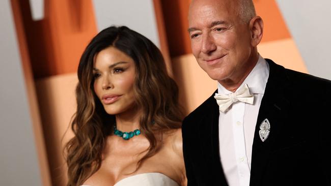 CEO of Amazon Jeff Bezos and partner Lauren Sanchez attend the Vanity Fair Oscar Party at the Wallis Annenberg Center for the Performing Arts in Beverly Hills, California, on March 2, 2025. (Photo by Michael Tran / AFP)