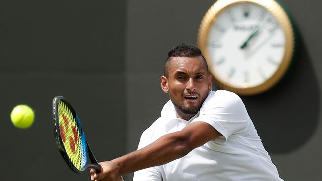 Australia's Nick Kyrgios returns the ball to Australia's Jordan Thompson during their men's singles first round match on the second day of the 2019 Wimbledon Championships.