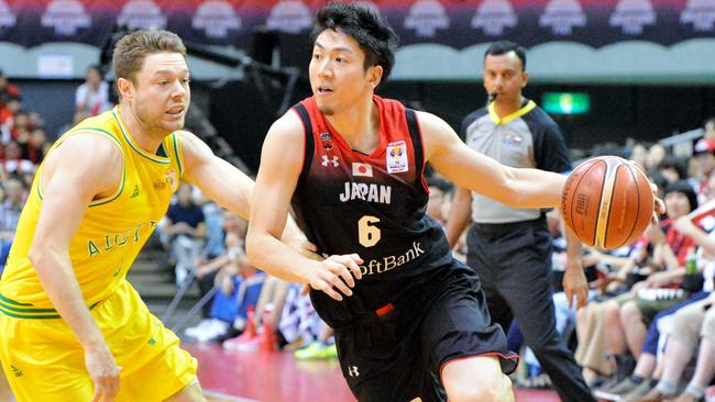 Makoto Hiejima signs with the Brisbane Bullets.