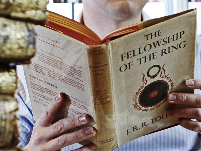 Book dealer Douglas Stewart with rare first edition of Lord of the Rings by J.R.R. Tolkien.