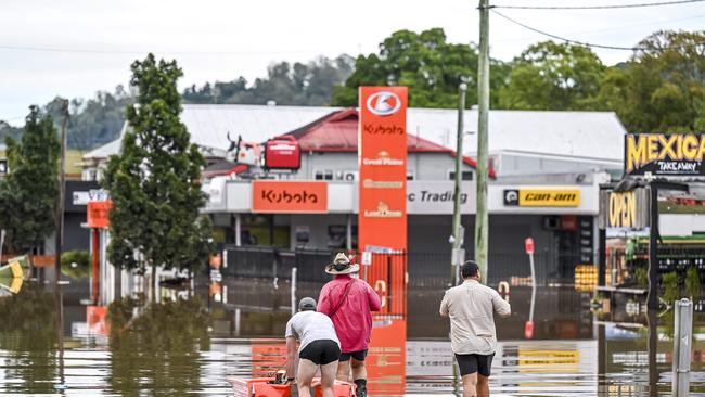 Lismore residents taking to the flood waters to see the damage caused in the 2022 deluge. Picture: Darren Leigh Roberts