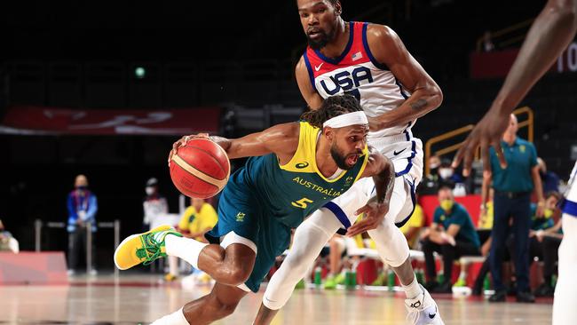 Patty Mills blasts past the USA’s Kevin Durant at the Tokyo Olympics. Picture: Adam Head